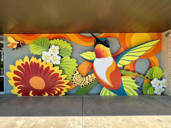 Colorful Bee The Sunshine outdoor mural and layered metal artwork